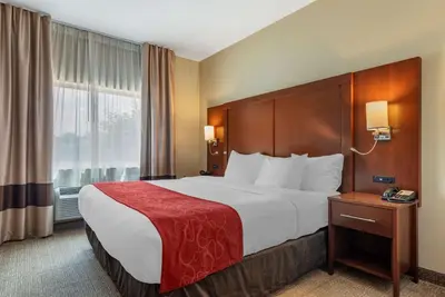 a hotel room with a large bed and a window at Comfort Suites Mason near Kings Island in Mason