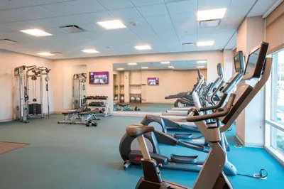 a gym with rows of treadmills and machines at Residence Inn by Marriott Cincinnati Midtown/Rookwood in Cincinnati