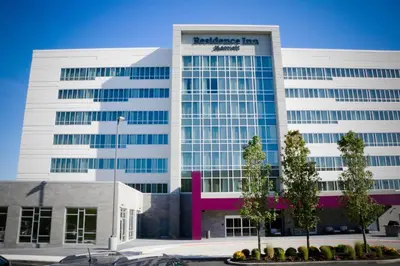 a large white building with a sign on it at Residence Inn by Marriott Cincinnati Midtown/Rookwood in Cincinnati