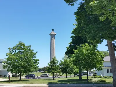 a tower in the middle of a park with trees at Put-in-Bay Waterfront Condo #103 in Put-in-Bay