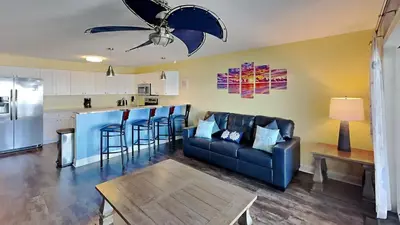 a living room with a couch and a kitchen at Put-in-Bay Waterfront Condo #103 in Put-in-Bay