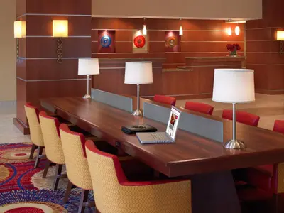 a conference room with a wooden table and chairs at Wyndham Cleveland Airport in Cleveland