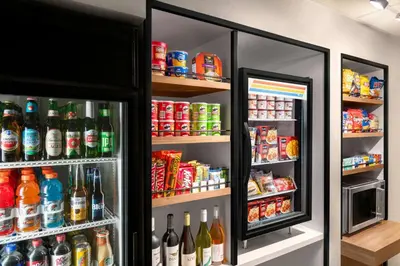 a refrigerator filled with lots of drinks and food at Courtyard Cleveland Airport South in Middleburg Heights