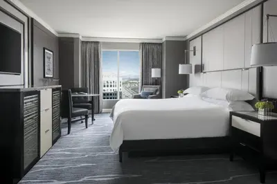 a hotel room with a large bed and a desk at The Ritz-Carlton, Cleveland in Cleveland