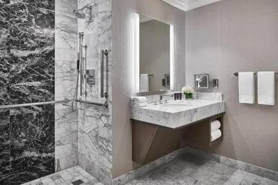 a bathroom with a sink and a shower at The Ritz-Carlton, Cleveland in Cleveland