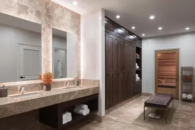 a bathroom with two sinks and a large mirror at The Ritz-Carlton, Cleveland in Cleveland