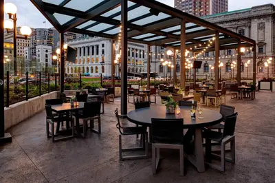 a restaurant with tables and chairs on a patio at Cleveland Marriott Downtown at Key Tower in Cleveland