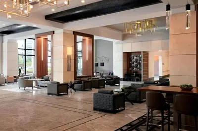 a lobby of a hotel with tables and chairs at Cleveland Marriott Downtown at Key Tower in Cleveland