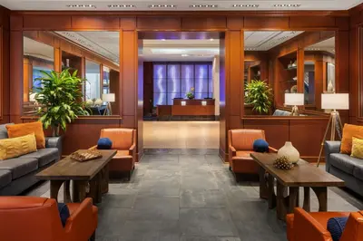 a lobby with couches and tables and a courtroom at Renaissance Columbus Downtown Hotel in Columbus