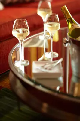 three glasses of white wine on a table at Renaissance Columbus Downtown Hotel in Columbus