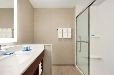 a bathroom with a sink and a shower at Holiday Inn Express & Suites - Cincinnati South - Wilder by IHG in Wilder