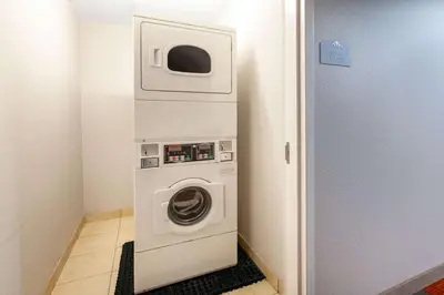 a washer and dryer in a small room at Microtel Inn & Suites by Wyndham Pittsburgh Airport in Robinson Township