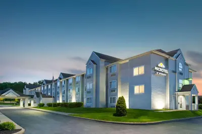 a rendering of the front of a hotel at Microtel Inn & Suites by Wyndham Pittsburgh Airport in Robinson Township