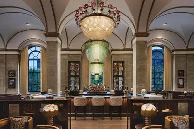 a large room with chairs and a chandelier at Hotel Cleveland Autograph Collection in Cleveland