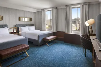 a hotel room with two beds and a television at Hotel Cleveland Autograph Collection in Cleveland