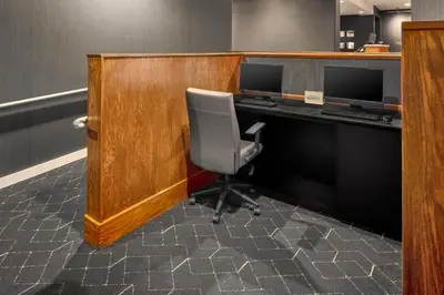 an office with a desk with a chair and a computer at Courtyard Columbus Dublin in Dublin