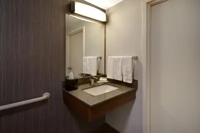 a bathroom with a sink and a mirror at Courtyard Columbus Dublin in Dublin