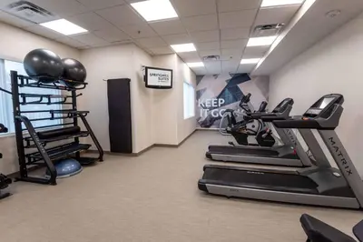 a gym with treadmills and exercise equipment in a room at SpringHill Suites Columbus Airport Gahanna in Gahanna