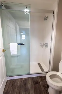 a bathroom with a glass shower with a toilet at TownePlace Suites Columbus Airport Gahanna in Gahanna