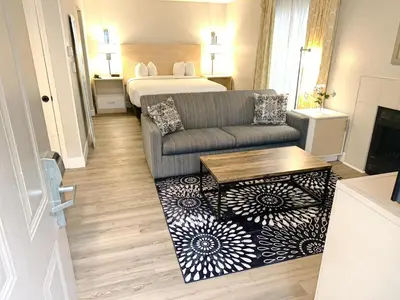 a living room with a couch and a bed at Sonesta ES Suites Cincinnati - Sharonville West in Sharonville