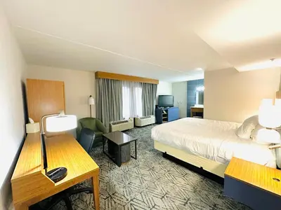 a hotel room with a bed and a desk at Townhouse Near Hall Of Fame Canton I 77 in Canton