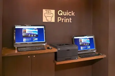 a computer and a printer sitting on a desk at Courtyard Cleveland Independence in Independence