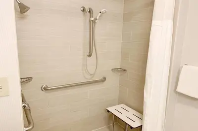 a bathroom with a shower with a toilet at Courtyard by Marriott Cleveland Westlake in Westlake