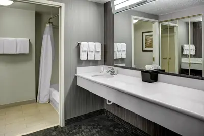 a bathroom with a sink and a mirror at Courtyard by Marriott Cleveland Westlake in Westlake