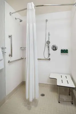 a bathroom with a shower with a shower curtain at Sonesta ES Suites Charleston in Charleston