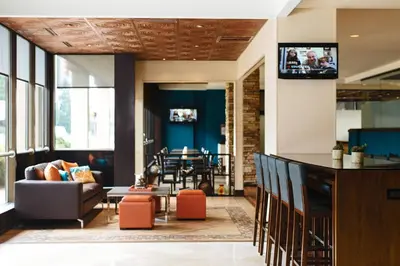 a living room with a couch and a table at Charleston Marriott Town Center in Charleston