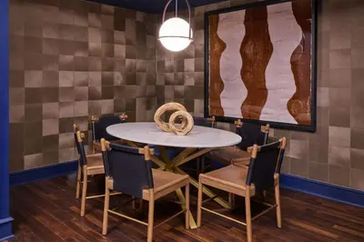 a table and chairs in a room with tiles at Marriott Lexington Griffin Gate Golf Resort & Spa in Lexington