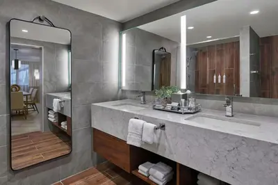 a bathroom with a large sink and a mirror at Marriott Lexington Griffin Gate Golf Resort & Spa in Lexington