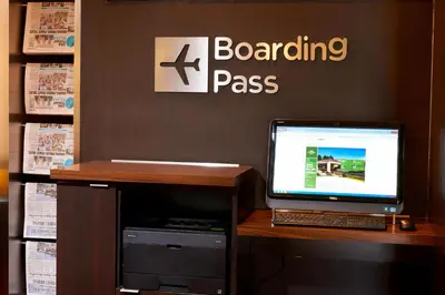 a desk with a laptop computer on top of it at Courtyard Toledo Airport Holland in Holland