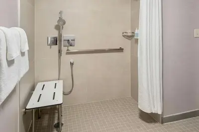 a bathroom with a shower with a shower curtain at Courtyard Toledo Maumee/Arrowhead in Maumee