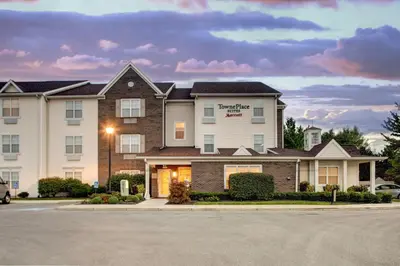 a building with a sign on the front of it at TownePlace Suites by Marriott Findlay in Findlay