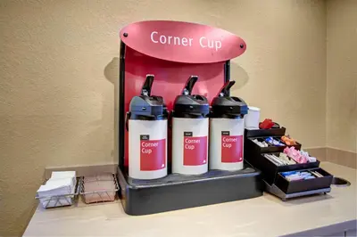a corner cupacist with four bottles of hair products at TownePlace Suites by Marriott Findlay in Findlay