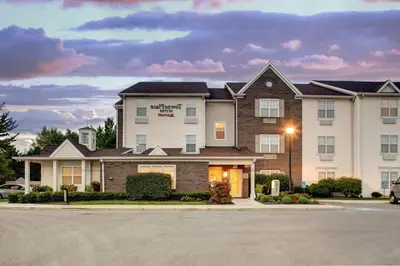a building with a sign on the front of it at TownePlace Suites by Marriott Findlay in Findlay