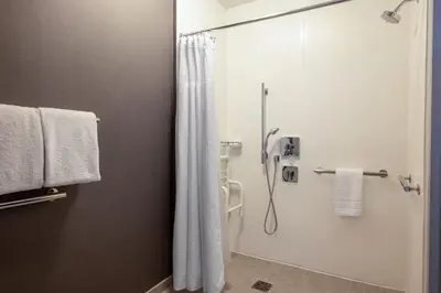 a bathroom with a shower with a shower curtain at Courtyard Columbus Airport in Columbus