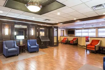 a lobby with chairs and a waiting room at Comfort Inn Cleveland Downtown in Cleveland