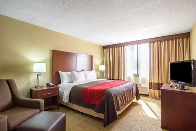a hotel room with a bed and a television at Comfort Inn Cleveland Downtown in Cleveland