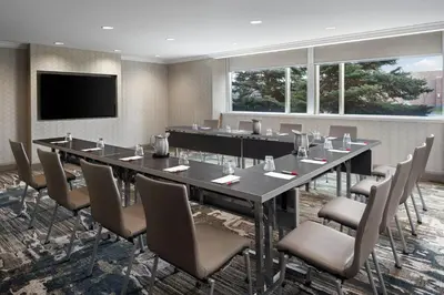 a conference room with a large table and chairs at Cleveland Marriott East in Warrensville Heights