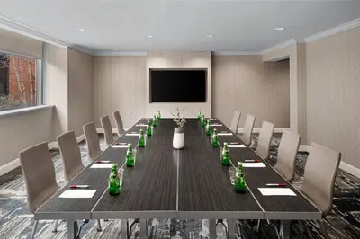 a conference room with a long table and chairs at Cleveland Marriott East in Warrensville Heights