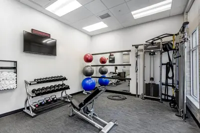 a fitness room with a gym with weights at Courtyard Columbus Easton in Columbus