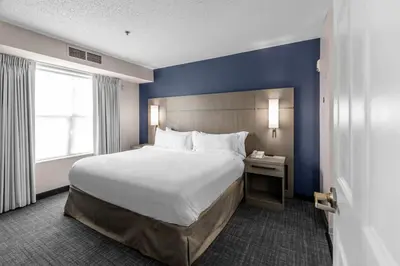 a hotel room with a large bed and a window at Residence Inn Columbus Easton in Columbus