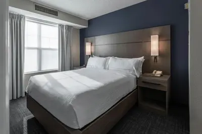 a bedroom with a large bed and a window at Residence Inn Columbus Easton in Columbus