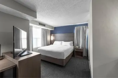 a hotel room with a bed and a television at Residence Inn Columbus Easton in Columbus