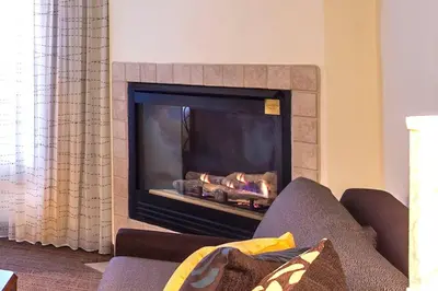 a fireplace in a living room with a couch at Residence Inn Columbus Easton in Columbus