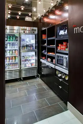 a large refrigerator with its doors open in a store at Courtyard Columbus Downtown in Columbus