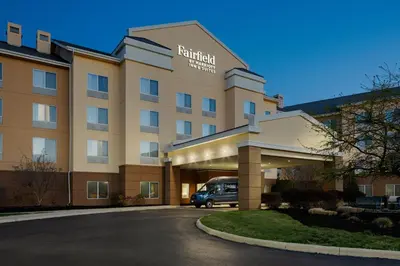 a hotel with a van parked in front of it at Fairfield Inn & Suites Columbus OSU in Columbus
