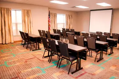 a classroom with desks and chairs in a room at Residence Inn Cincinnati Airport in Erlanger